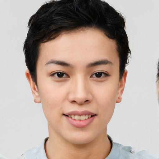 Joyful asian young-adult female with short  brown hair and brown eyes