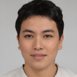 Joyful asian young-adult male with short  brown hair and brown eyes