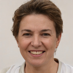 Joyful white adult female with short  brown hair and brown eyes