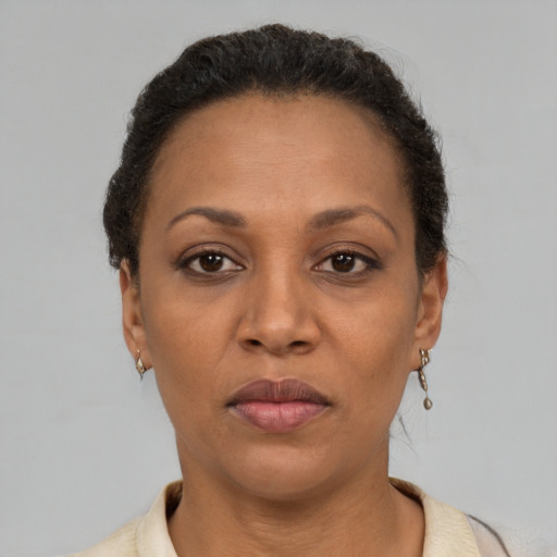 Neutral latino adult female with short  brown hair and brown eyes