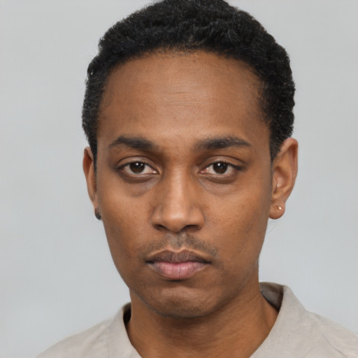 Neutral black young-adult male with short  black hair and brown eyes