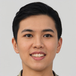 Joyful asian young-adult male with short  black hair and brown eyes