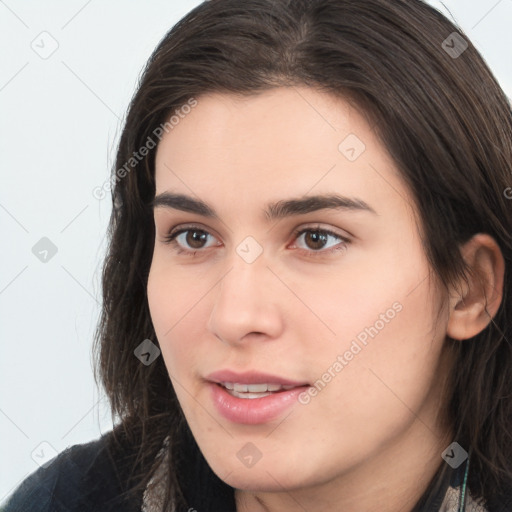 Neutral white young-adult female with long  brown hair and brown eyes