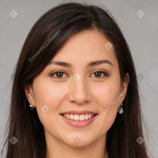 Joyful white young-adult female with long  brown hair and brown eyes