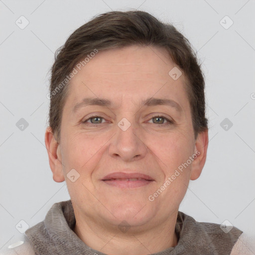 Joyful white adult male with short  brown hair and grey eyes