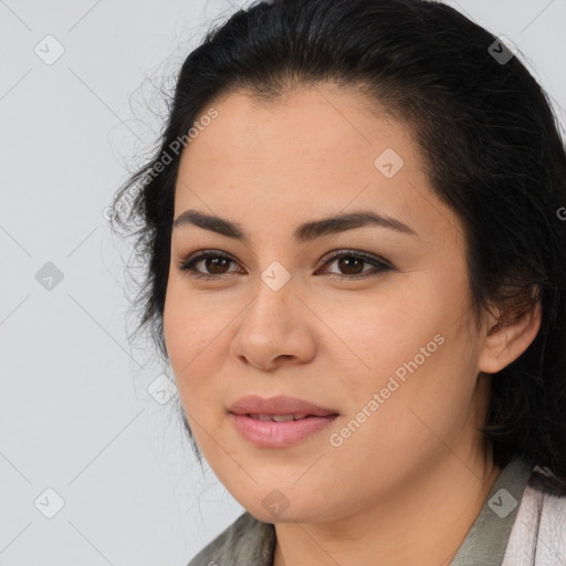 Joyful latino young-adult female with medium  brown hair and brown eyes