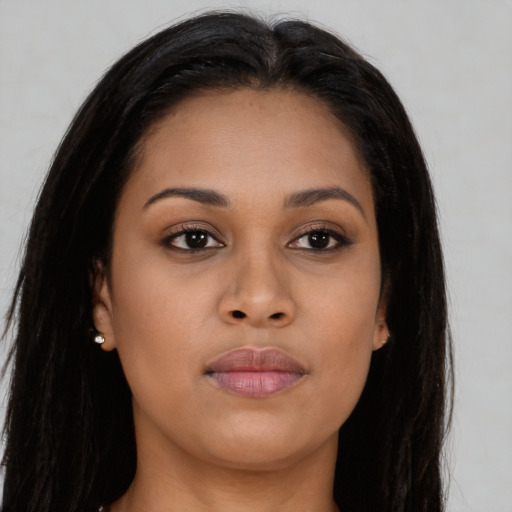 Joyful asian young-adult female with long  brown hair and brown eyes