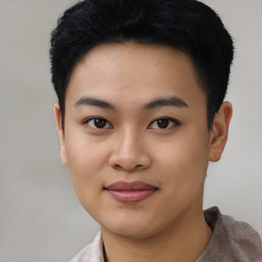 Joyful asian young-adult female with short  black hair and brown eyes