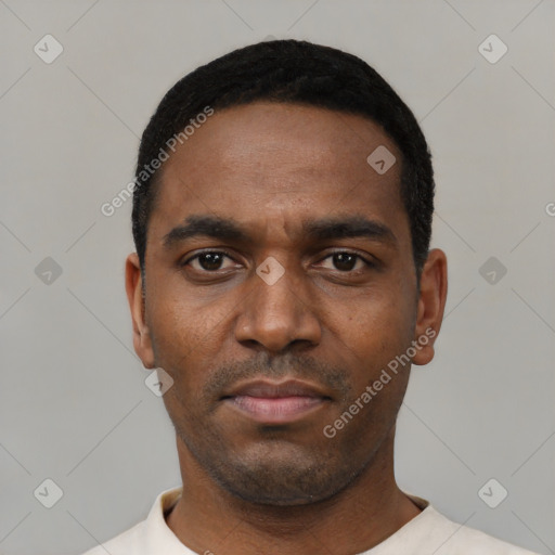 Neutral black young-adult male with short  black hair and brown eyes