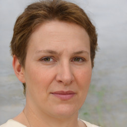 Joyful white adult female with short  brown hair and grey eyes