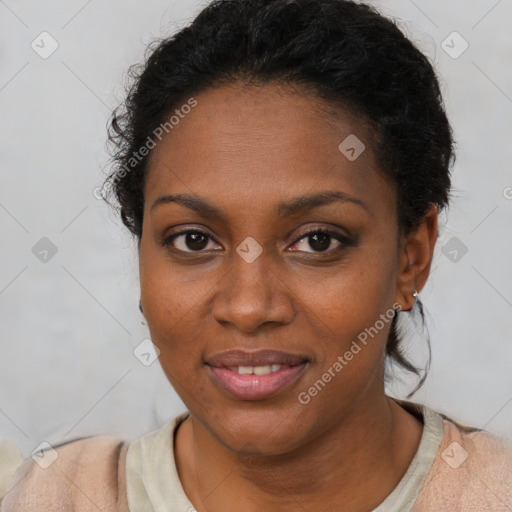 Joyful black young-adult female with short  brown hair and brown eyes