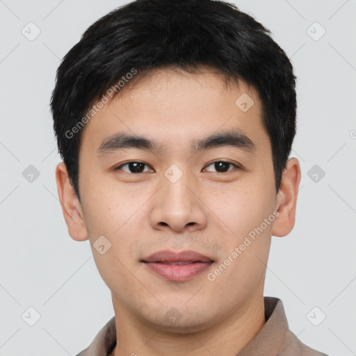 Joyful asian young-adult male with short  black hair and brown eyes