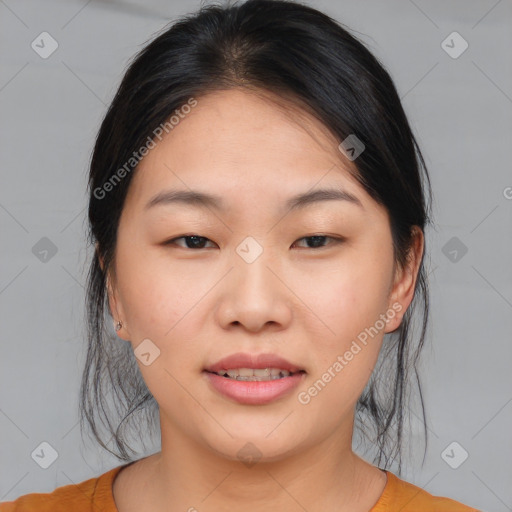 Joyful asian young-adult female with medium  brown hair and brown eyes