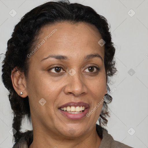 Joyful latino adult female with medium  brown hair and brown eyes