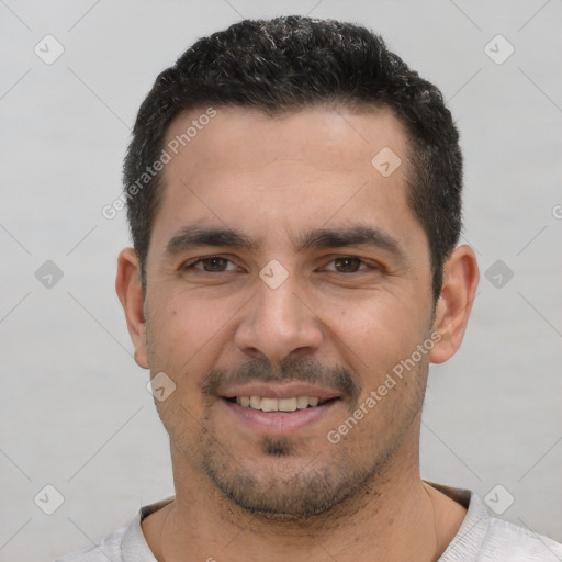 Joyful white young-adult male with short  black hair and brown eyes