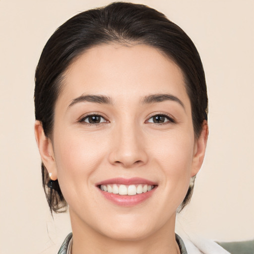 Joyful white young-adult female with medium  brown hair and brown eyes