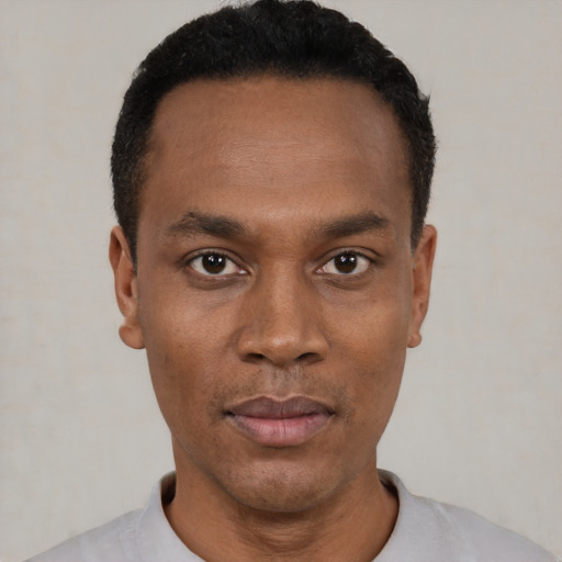 Neutral black young-adult male with short  black hair and brown eyes