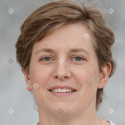 Joyful white adult female with medium  brown hair and grey eyes