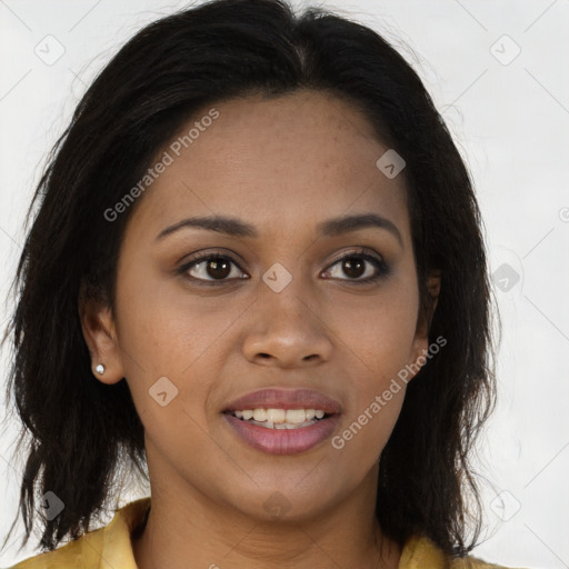 Joyful black young-adult female with long  brown hair and brown eyes