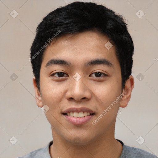 Joyful asian young-adult male with short  black hair and brown eyes