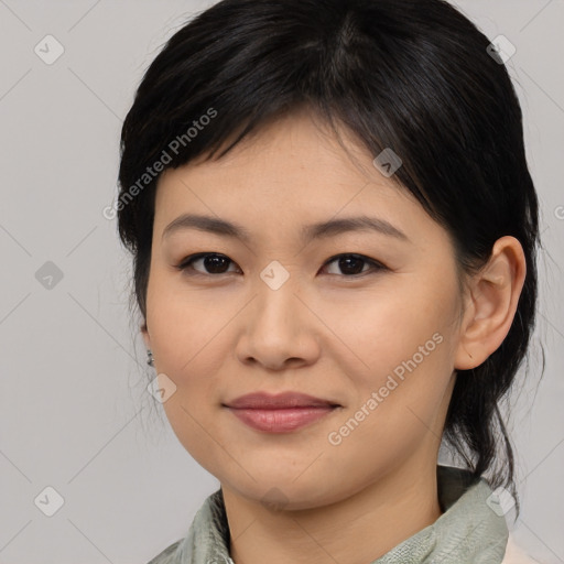 Joyful asian young-adult female with medium  brown hair and brown eyes