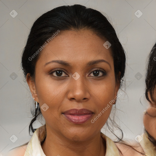 Joyful black adult female with medium  brown hair and brown eyes