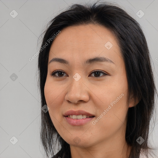 Joyful asian young-adult female with long  brown hair and brown eyes