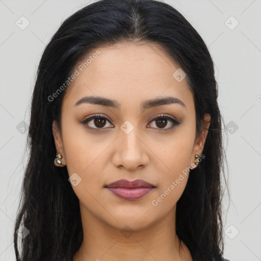 Joyful latino young-adult female with long  brown hair and brown eyes