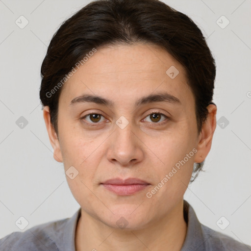 Joyful white adult female with short  brown hair and brown eyes