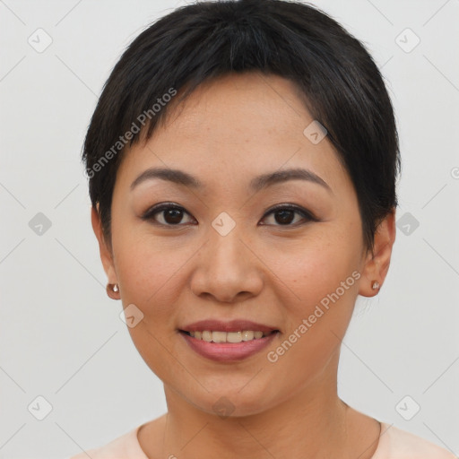 Joyful asian young-adult female with short  brown hair and brown eyes