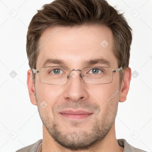 Joyful white adult male with short  brown hair and grey eyes