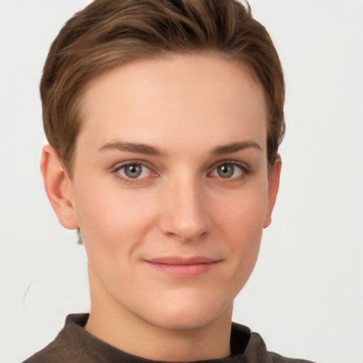 Joyful white young-adult female with short  brown hair and grey eyes