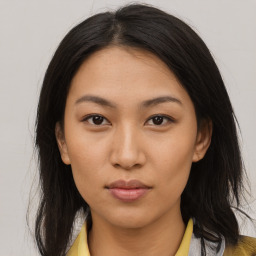 Neutral asian young-adult female with medium  brown hair and brown eyes