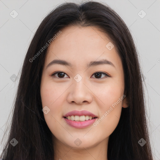 Joyful asian young-adult female with long  brown hair and brown eyes