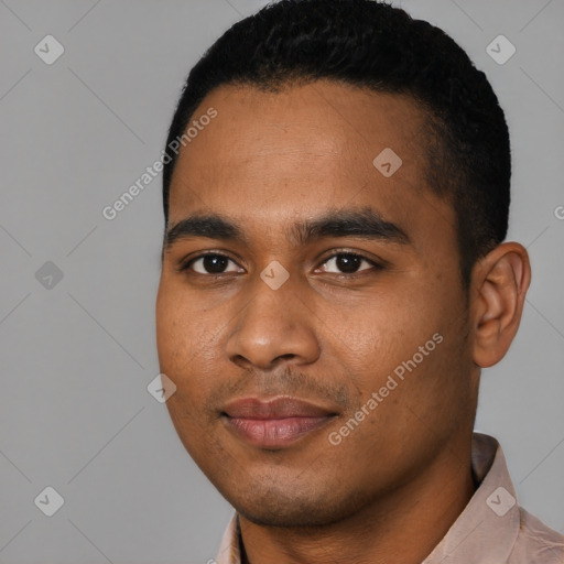 Joyful black young-adult male with short  black hair and brown eyes