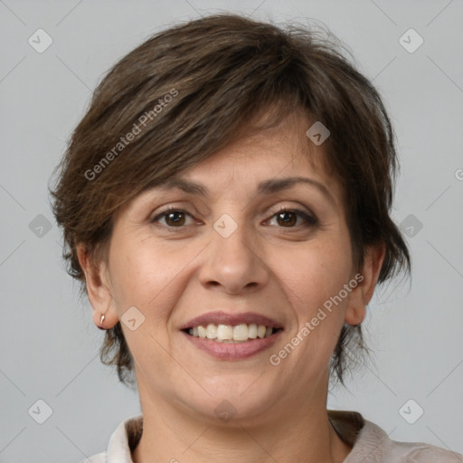 Joyful white adult female with medium  brown hair and brown eyes