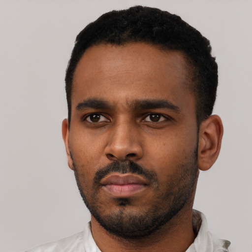 Neutral black young-adult male with short  black hair and brown eyes