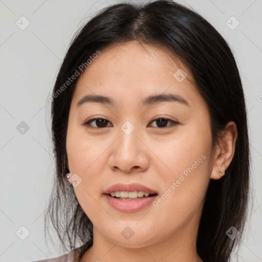 Joyful asian young-adult female with medium  brown hair and brown eyes