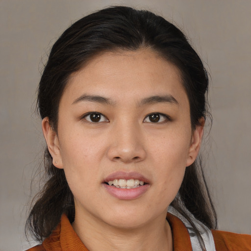 Joyful white young-adult female with medium  brown hair and brown eyes