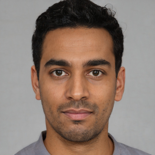 Neutral latino young-adult male with short  black hair and brown eyes