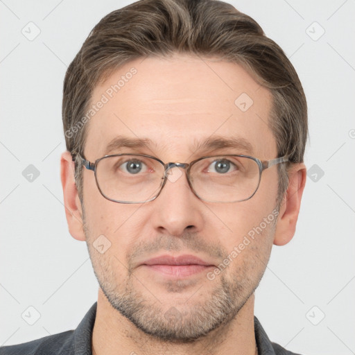 Joyful white adult male with short  brown hair and grey eyes