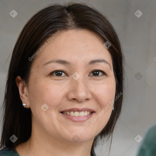 Joyful white adult female with medium  brown hair and brown eyes