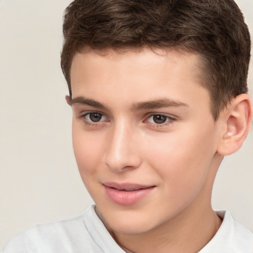 Joyful white child male with short  brown hair and brown eyes