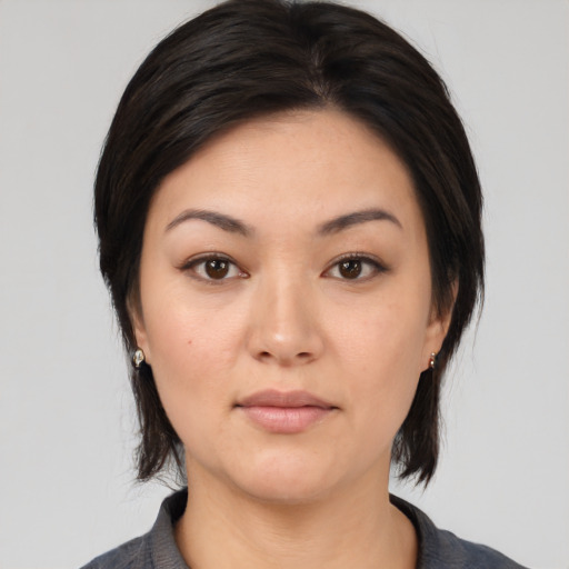 Neutral asian young-adult female with medium  black hair and brown eyes