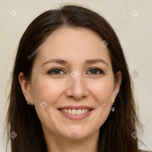 Joyful white adult female with long  brown hair and brown eyes