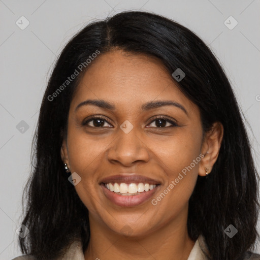 Joyful black young-adult female with long  black hair and brown eyes