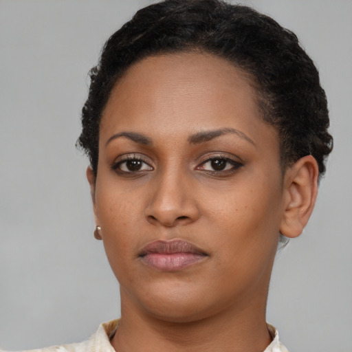 Neutral black young-adult female with short  brown hair and brown eyes