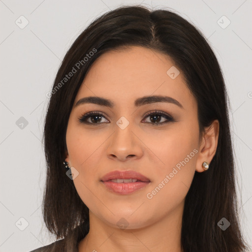 Joyful latino young-adult female with long  brown hair and brown eyes