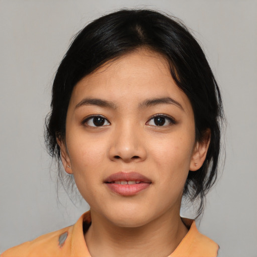 Joyful asian young-adult female with medium  black hair and brown eyes
