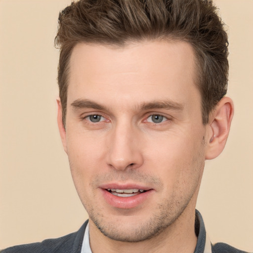 Joyful white young-adult male with short  brown hair and brown eyes